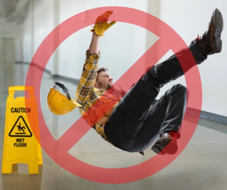PowerKleen workplace safety graphic showing a worker slipping on a wet floor beside a caution sign with a red prohibition symbol overlay.